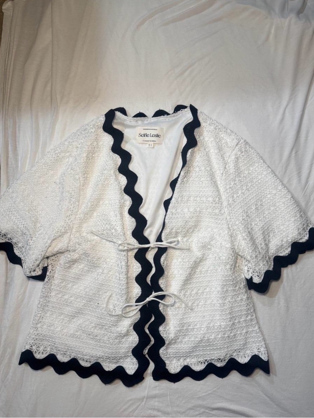 Selfie Leslie White Crochet Cardigan with Black Scalloped Trim and Tie Fronts